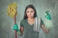 Lazy cleaning woman housewife or house maid service cleaner girl looking tired and frustrated holding mop and detergent spray Royalty Free Stock Photo