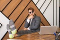 A lazy employee Sitting at a laptop With his feet on the table, A bored concept at work Royalty Free Stock Photo