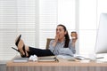 Lazy employee yawning at table