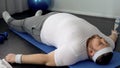 Lazy fat lying on fitness mat at home, obesity difficulties, weak muscles Royalty Free Stock Photo