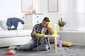 Lazy man procrastinating while cleaning Royalty Free Stock Photo