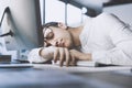 Lazy office worker sleeping at his desk Royalty Free Stock Photo