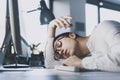 Lazy office worker sleeping at his desk Royalty Free Stock Photo