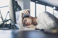 Lazy office worker sleeping at his desk Royalty Free Stock Photo