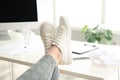 Lazy overweight worker with feet on desk in office Royalty Free Stock Photo