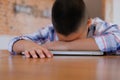 lazy stressed young little asian kid boy resting sleeping on de Royalty Free Stock Photo