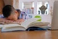 lazy stressed young little asian kid boy resting sleeping on de Royalty Free Stock Photo