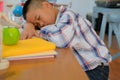 lazy stressed young little asian kid boy resting sleeping on de Royalty Free Stock Photo