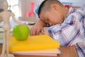 lazy stressed young little asian kid boy resting sleeping on de Royalty Free Stock Photo