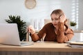 Lazy worker at wooden desk Royalty Free Stock Photo