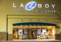 LazyBoy Furniture Gallery at night with holiday decor inside entrance