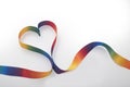 LBGTQ concept with rainbow ribbon in heart shape Royalty Free Stock Photo