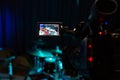 The LCD display on the camcorder. Filming the concert. Drum set and bass