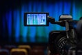 The LCD display on the camcorder. Shooting theatrical performances. The TV camera. Colorful chairs in the auditorium Royalty Free Stock Photo