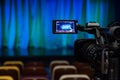 The LCD display on the camcorder. Shooting theatrical performances. The TV camera. Colorful chairs in the auditorium Royalty Free Stock Photo