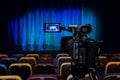 The LCD display on the camcorder. Shooting theatrical performances. The TV camera. Colorful chairs in the auditorium Royalty Free Stock Photo