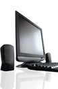 LCD screen with speakers and black keyboard reflected from a tab Royalty Free Stock Photo