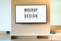 LCD TV mockup in living room. Large Widescreen LCD TV display panel on wood wall for your advertisement artwork. Mock up LCD, OLED Royalty Free Stock Photo