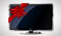 LCD TV with red bow Royalty Free Stock Photo