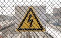 Ld aged rusty triangle metal plate with High voltage warning sign. Royalty Free Stock Photo
