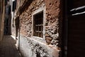 Ld, textured, high contrast wall with little window. City of Italy during quarantine of coronavirus desease. Venecia