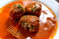 Le boulet with tomato sauce with pieses of bunching onio non top Royalty Free Stock Photo