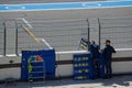 Mechanics inform drivers from the pitlane