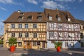 Le Comptoir de Georges Restaurant and La Maison Bleue, half timbered houses at Place des 6 Montagnes Noires in Colmar, France Royalty Free Stock Photo