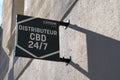 Le dispensaire cbd 24/7 sign logo and brand text on cbd shop vending machine in city