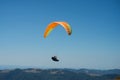 Paraglider flying on blue sky background Royalty Free Stock Photo