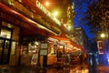 Le Grand Cafe Capucines at rainy evening . It is the legendary and famous brasserie on Grands Boulevards. Inscription in