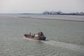 Cargo ship at river Seine near harbor of Le Havre, France