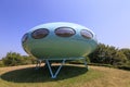 Green UFO plastic Futuro house designed by Matti Suuronen. Royalty Free Stock Photo