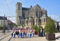 LE MANS, FRANCE - APRIL 22, 2017: Festival Europe jazz People dancing in carribean costumes near Roman cathedral of Saint Julien a