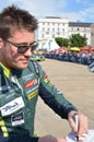 LE MANS, FRANCE - JUNE 11, 2017: Famous New Zealander racer Richie Stanaway Aston Martin Racing gives autograph during represantat