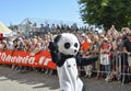 LE MANS, FRANCE - JUNE 16, 2017: A man dressed as a panda suit dances at a parade of pilots racing in Le mans