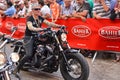 LE MANS, FRANCE - JUNE 13, 2014:Parade of pilots racing. Old women on motorcycle