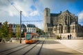 LE MANS, FRANCE - OCTOBER 08, 2017: Roman cathedral of Saint Julien with an orange tram at a Le mans, France