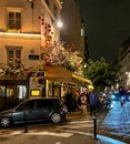 Le Vrai Paris restaurant awning decorated with pink and white sprays of flowers, October 2021, Paris, France