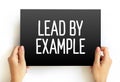 Lead By Example text on card, concept background Royalty Free Stock Photo