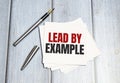 lead by example text write on white paper Royalty Free Stock Photo