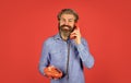 Lead generation specialist. Sales script. Bearded man phone conversation. Retro phone. Outdated technology. Manager