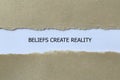 beliefs create reality on white paper Royalty Free Stock Photo
