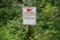 Sign reminding anglers this is a limited harvest fishing area, rainbow trout for catch and Royalty Free Stock Photo