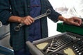 Lead woman mechanic working with special metal equipments in aviation garage Royalty Free Stock Photo