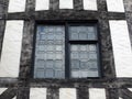 Leaded glass window in a half timbered house Royalty Free Stock Photo