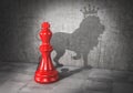 Leader concept. Headman. Chess king cast shadow in form of lion with crown.