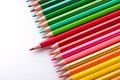 Leader concept with one pencil standing out of crowd of other pencils Royalty Free Stock Photo