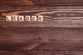 Leader, leadership, lead word on wooden background