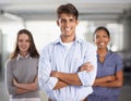 The leader of the pack. A young business team standing with arms folded. Royalty Free Stock Photo